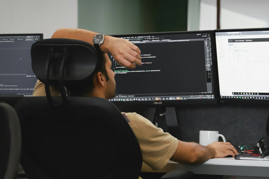 person working on code at desk