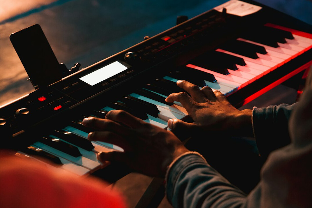 Close-up of hands typing on a laptop keyboard