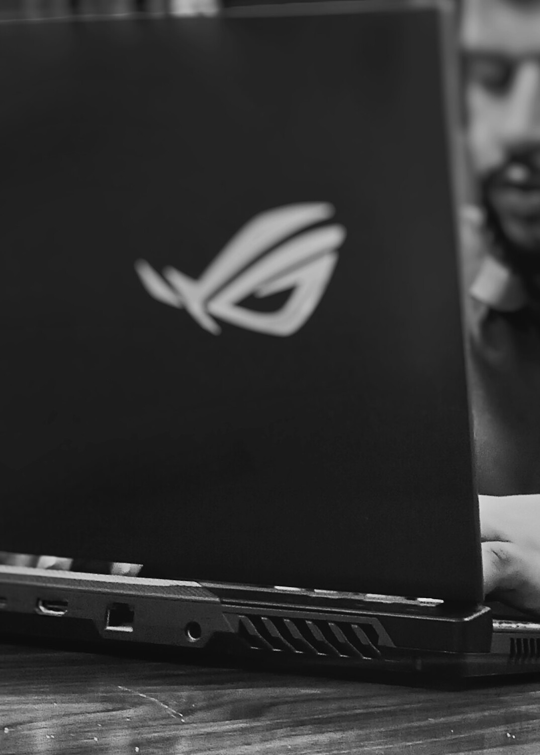 person coding on laptop